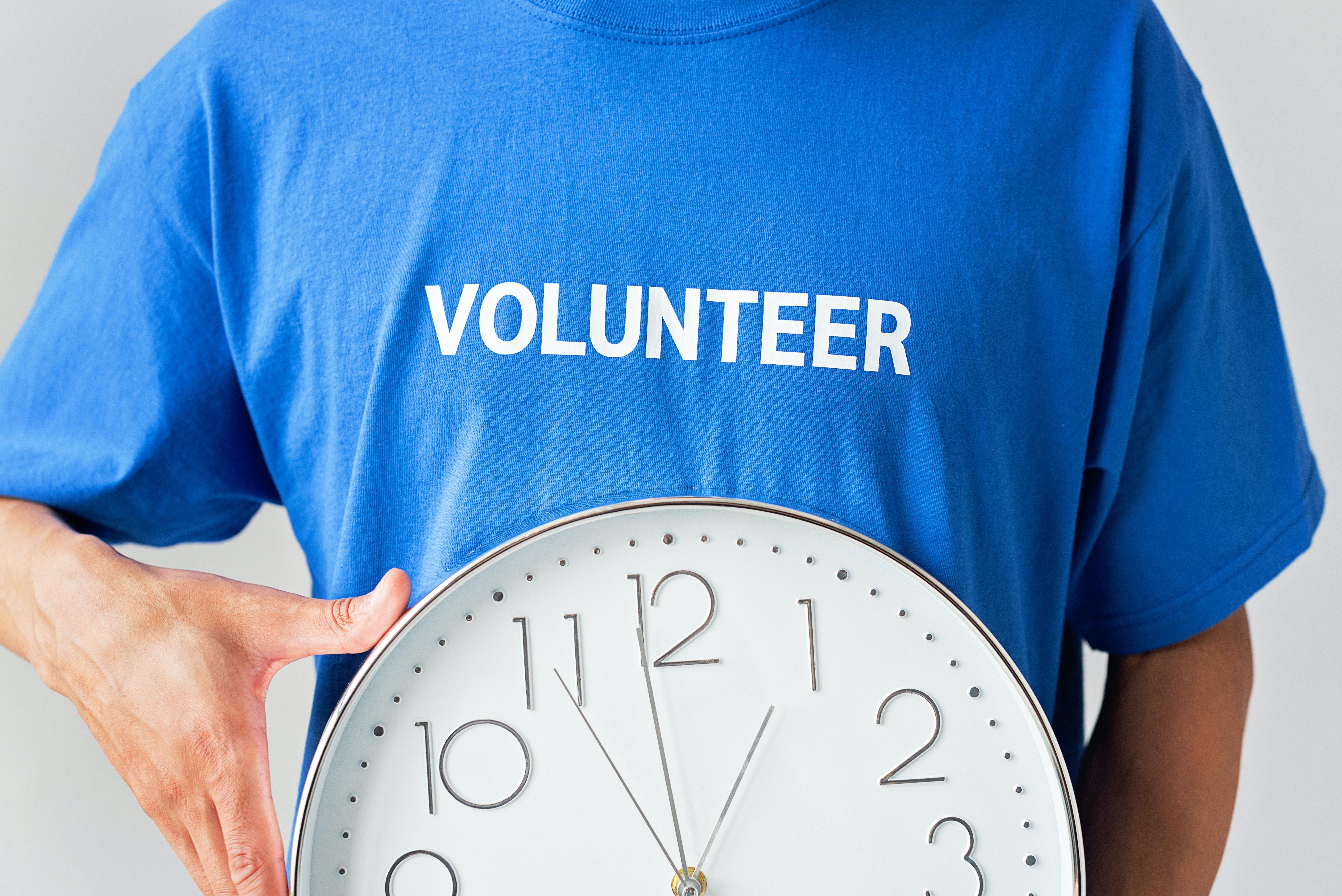 Volunteer helping an older adult
