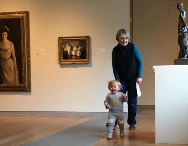 Senior and child exploring a musem